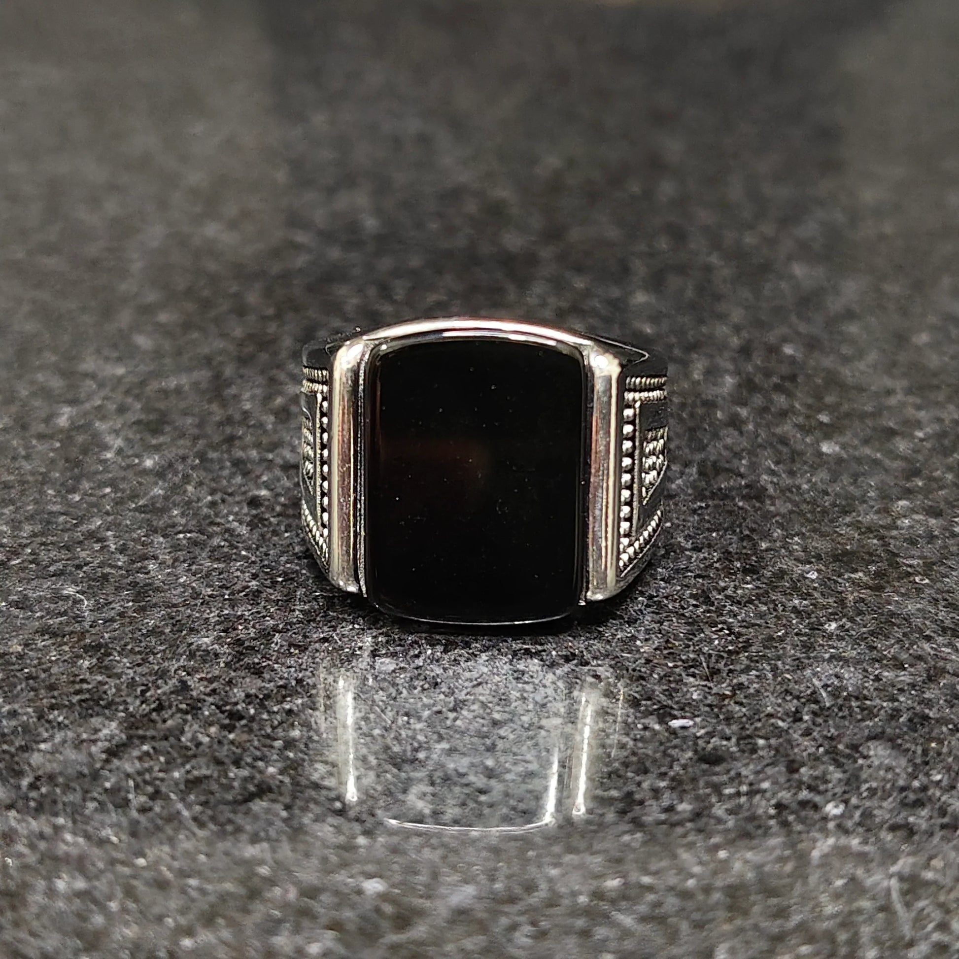Silver Egyptian ring for men with black rectangular stone and detailed side engravings