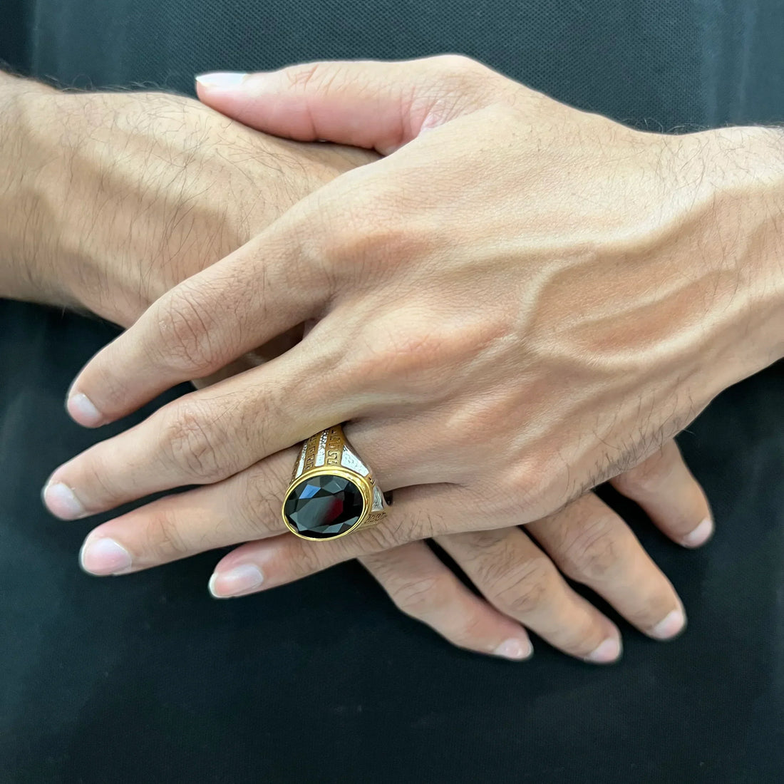Silver gold oval medusa ring for men with black oval gemstone and intricate gold and silver patterns