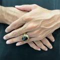 Silver gold oval medusa ring for men worn on hand with black oval stone and detailed band design
