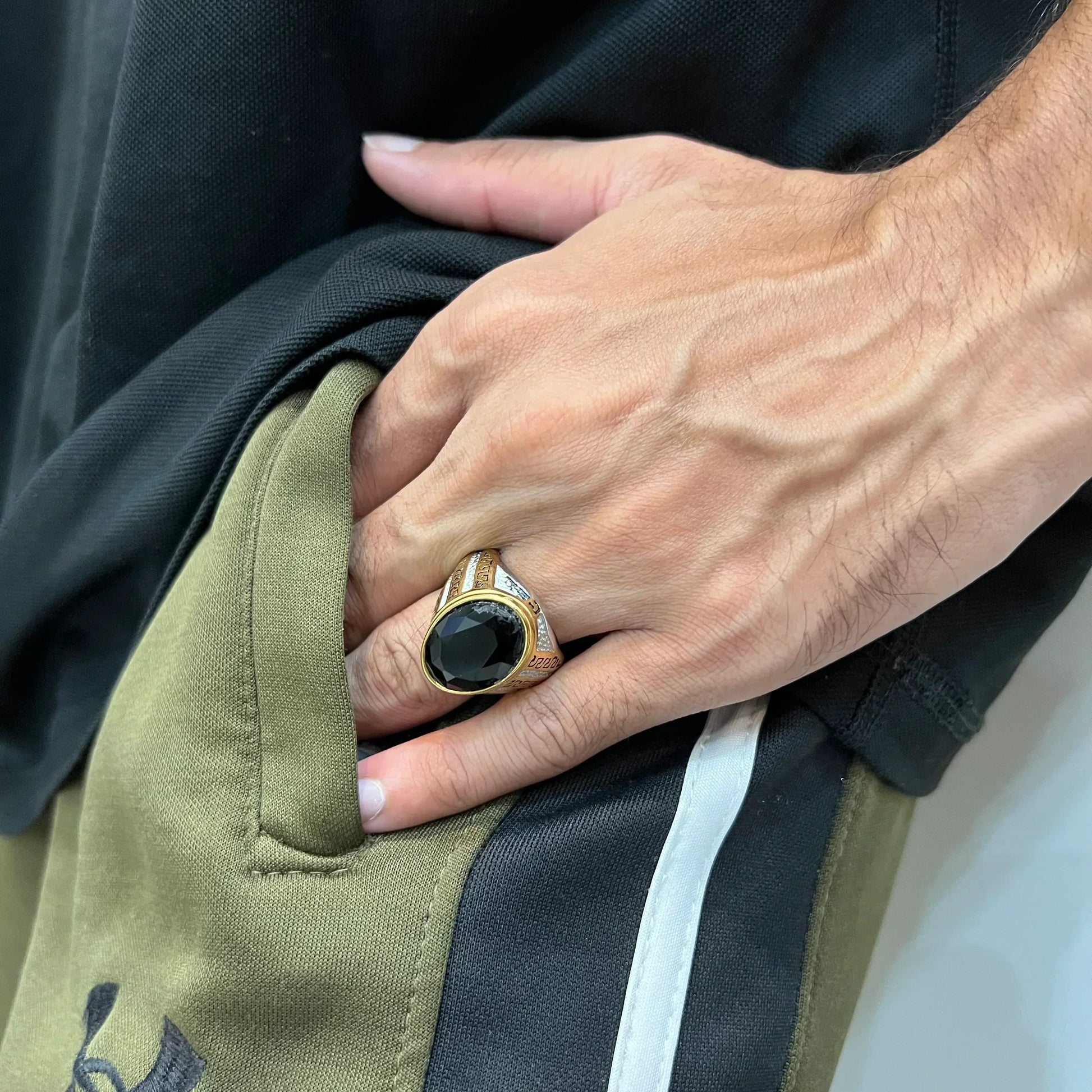 Silver gold oval medusa ring for men worn on hand with black stone and intricate design