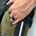 Silver medusa small pattern ring for men worn on hand with olive green and black clothing